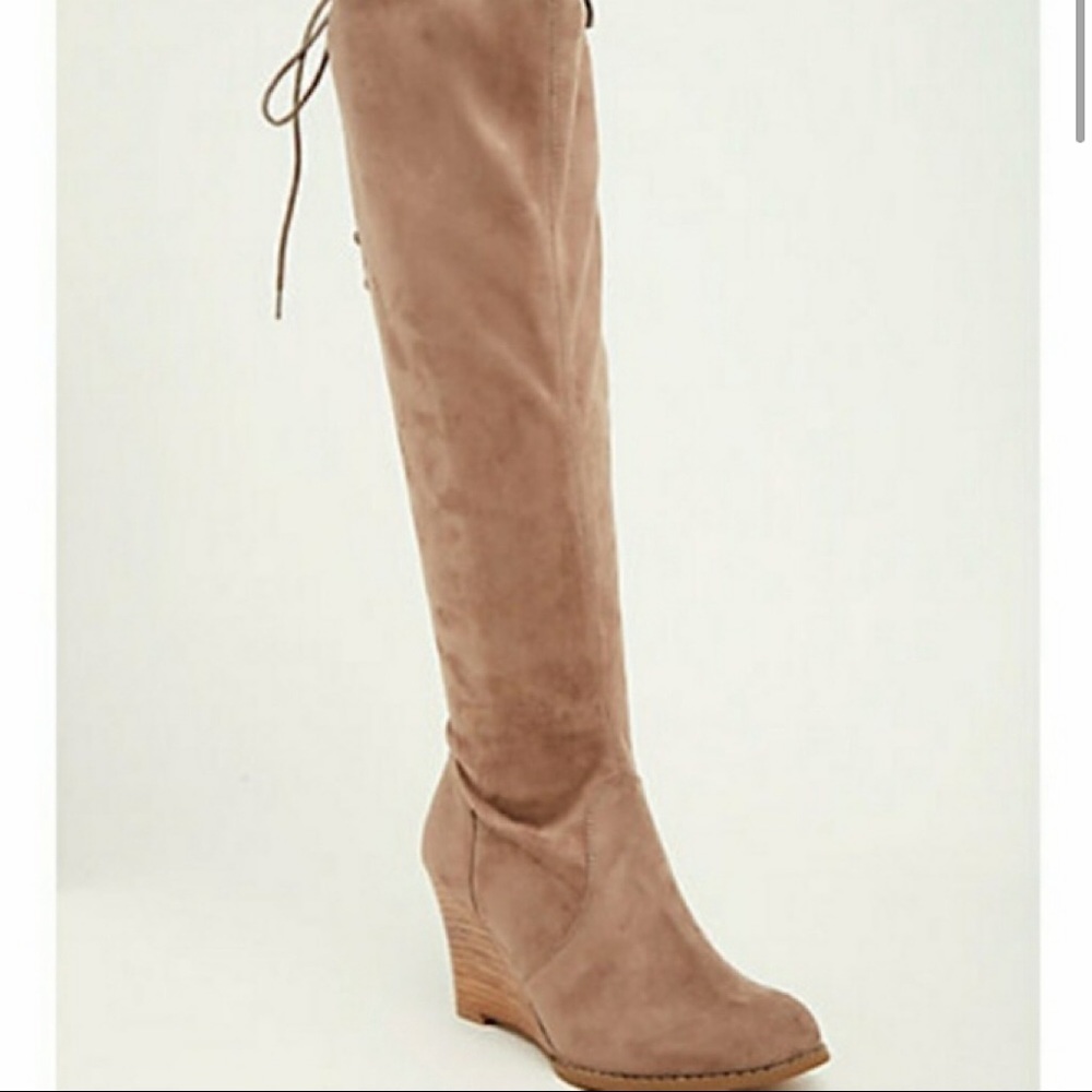 Torrid suede lace up knee high boots.